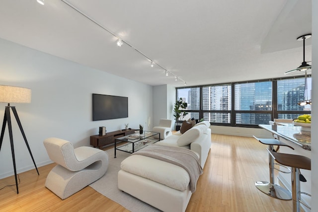 360 E Randolph St Unit 3305, Chicago, IL 60601 - living area featuring rail lighting and light wood-style flooring
