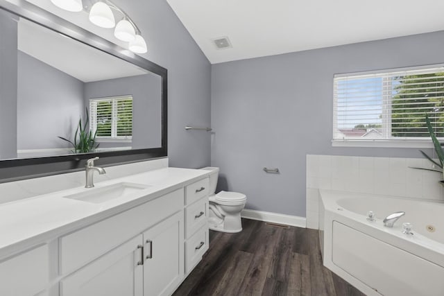 1519 Parkside Dr, Plainfield, IL 60586 - full bathroom featuring vanity, a tub with jets, wood finished floors, and vaulted ceiling