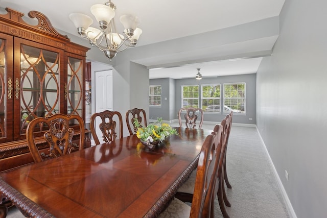 1519 Parkside Dr, Plainfield, IL 60586 - carpeted dining area featuring a chandelier and ceiling fan