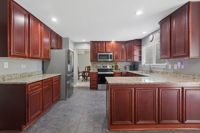 1519 Parkside Dr, Plainfield, IL 60586 - kitchen with reddish brown cabinets, stainless steel appliances, a peninsula, open shelves, and recessed lighting