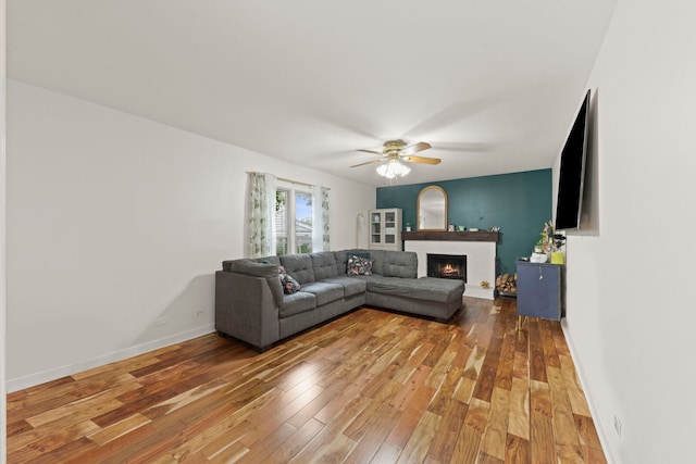 1004 Evergreen Dr, Carol Stream, IL 60188 - living area with wood-type flooring, a brick fireplace, and a ceiling fan