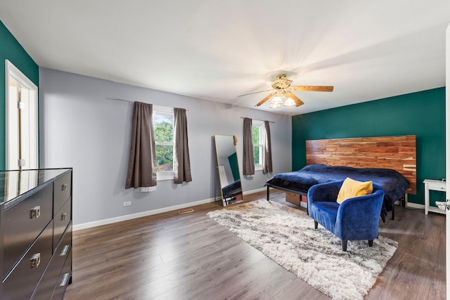 1004 Evergreen Dr, Carol Stream, IL 60188 - bedroom featuring wood finished floors, a ceiling fan, and an accent wall