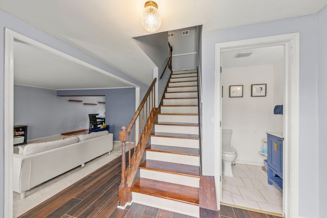 1004 Evergreen Dr, Carol Stream, IL 60188 - stairs with a wood stove and baseboards