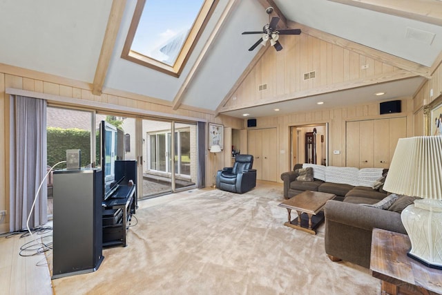 937 Braeburn Rd, Inverness, IL 60067 - living room featuring wooden walls, beam ceiling, a ceiling fan, a skylight, and high vaulted ceiling