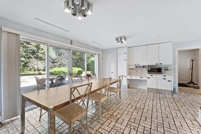 937 Braeburn Rd, Inverness, IL 60067 - dining room with brick patterned floors and baseboards