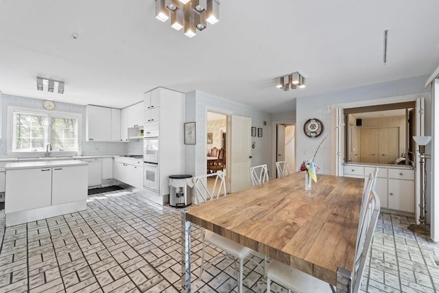 937 Braeburn Rd, Inverness, IL 60067 - dining space with brick patterned floors and a chandelier