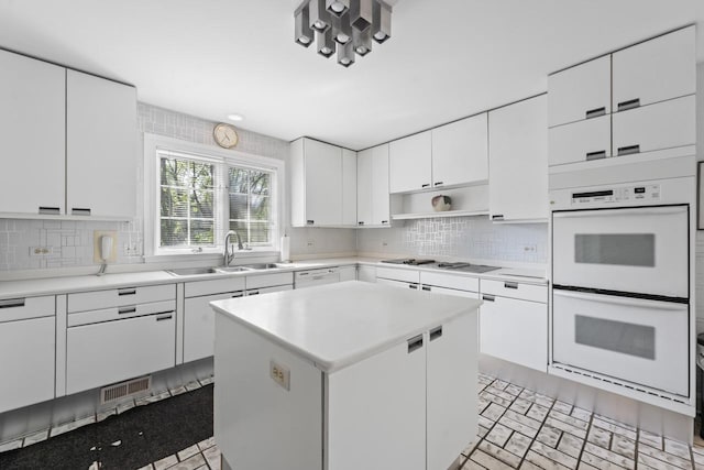 937 Braeburn Rd, Inverness, IL 60067 - kitchen with white appliances, tasteful backsplash, open shelves, light countertops, and white cabinets