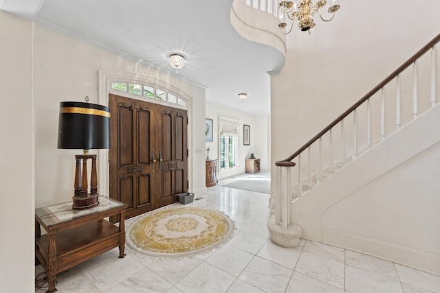 937 Braeburn Rd, Inverness, IL 60067 - entrance foyer with marble finish floors, stairway, crown molding, and a chandelier