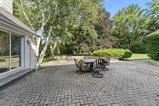 937 Braeburn Rd, Inverness, IL 60067 - view of patio / terrace with outdoor dining space and view of wooded area