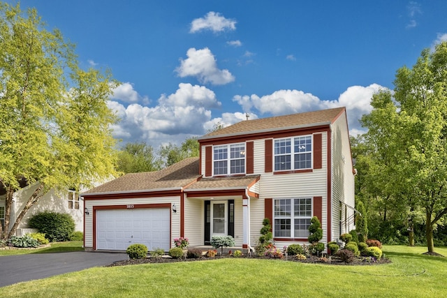 2853 Forestview Dr, Carpentersville, IL 60110 - view of front facade with an attached garage, driveway, a front lawn, and roof with shingles