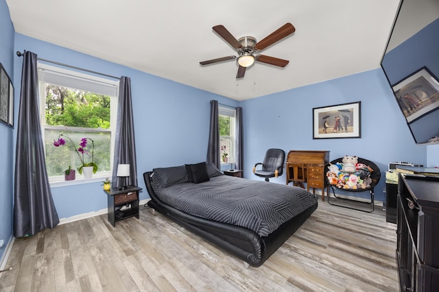 2853 Forestview Dr, Carpentersville, IL 60110 - bedroom featuring light wood-style flooring and a ceiling fan