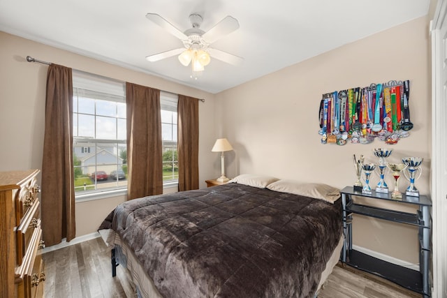 2853 Forestview Dr, Carpentersville, IL 60110 - bedroom featuring wood finished floors and ceiling fan