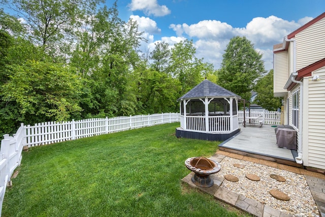 2853 Forestview Dr, Carpentersville, IL 60110 - fenced backyard featuring a gazebo, a fire pit, and a deck