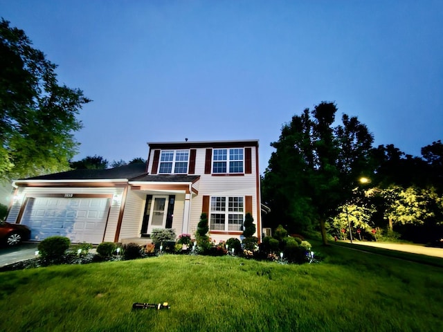 2853 Forestview Dr, Carpentersville, IL 60110 - traditional-style house with an attached garage and a front lawn