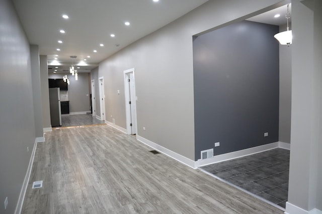 8346 S Baltimore Ave, Chicago, IL 60617 - hallway with wood finished floors and recessed lighting