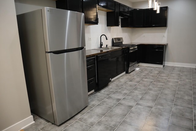 8346 S Baltimore Ave, Chicago, IL 60617 - kitchen with stainless steel appliances, dark cabinetry, tasteful backsplash, and under cabinet range hood