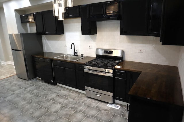 8346 S Baltimore Ave, Chicago, IL 60617 - kitchen with appliances with stainless steel finishes, dark countertops, range hood, dark cabinets, and tasteful backsplash