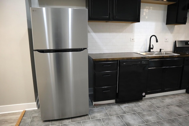 8346 S Baltimore Ave, Chicago, IL 60617 - kitchen featuring freestanding refrigerator, black dishwasher, dark countertops, and backsplash