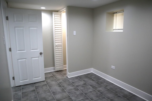 8346 S Baltimore Ave, Chicago, IL 60617 - below grade area with dark tile patterned flooring and recessed lighting