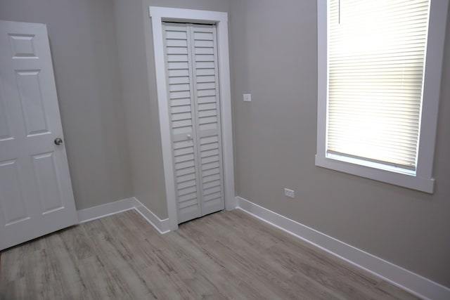 8346 S Baltimore Ave, Chicago, IL 60617 - unfurnished bedroom with a closet and light wood-style flooring