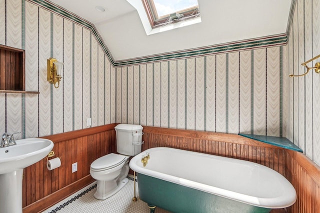 18229 Riegel Rd, Homewood, IL 60430 - bathroom with a freestanding tub, wallpapered walls, and a skylight