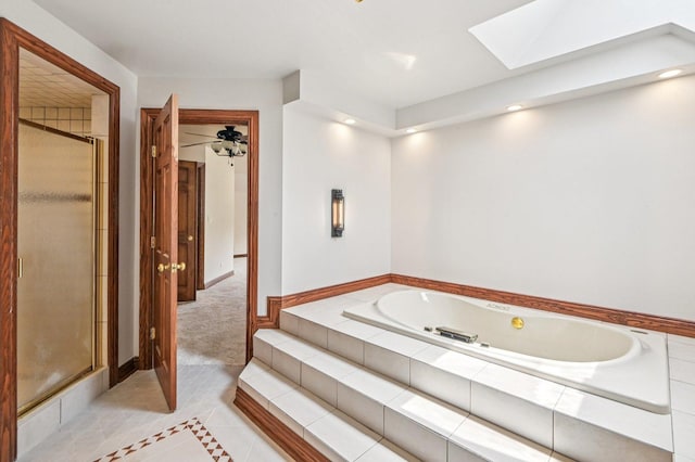 18229 Riegel Rd, Homewood, IL 60430 - bathroom featuring a skylight, a tub with jets, a shower stall, tile patterned flooring, and recessed lighting