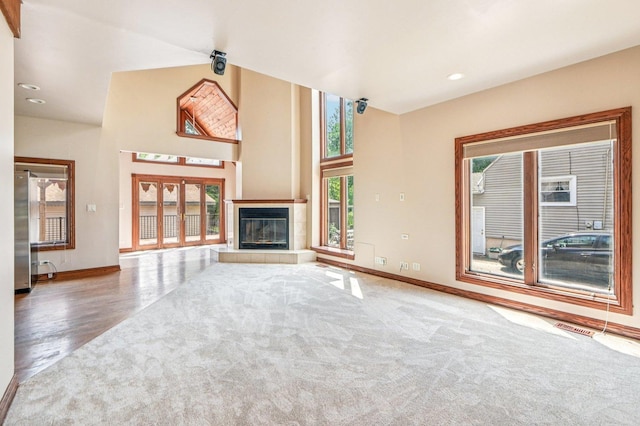 18229 Riegel Rd, Homewood, IL 60430 - unfurnished living room featuring a fireplace, carpet floors, recessed lighting, and wood finished floors