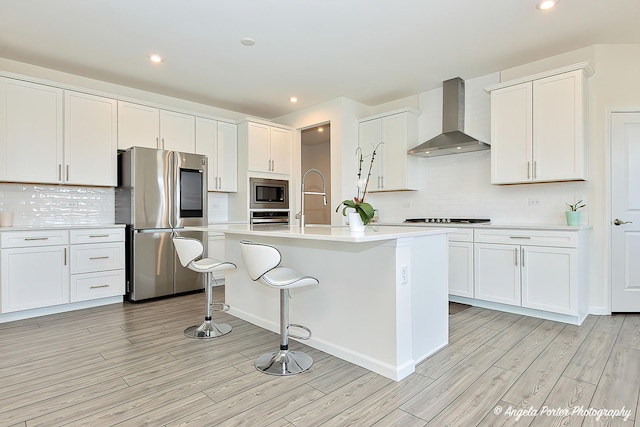 21725 N Ashley St, Kildeer, IL 60047 - kitchen featuring stainless steel appliances, wall chimney exhaust hood, light wood-style floors, light countertops, and recessed lighting
