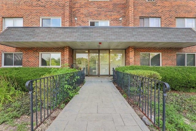 4711 Saint Joseph Creek Rd Unit 1E, Lisle, IL 60532 - property entrance featuring brick siding