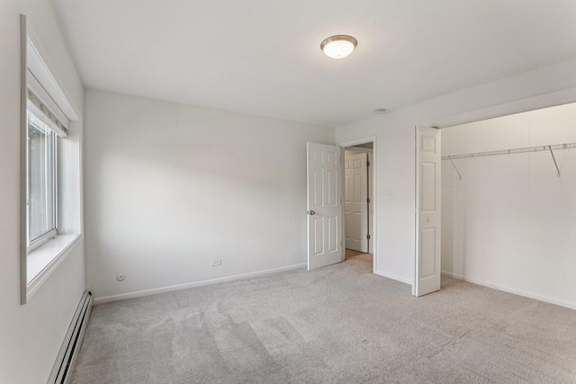 4711 Saint Joseph Creek Rd Unit 1E, Lisle, IL 60532 - unfurnished bedroom with a baseboard heating unit, carpet floors, and a closet