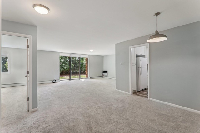 4711 Saint Joseph Creek Rd Unit 1E, Lisle, IL 60532 - empty room with carpet, a baseboard heating unit, and a wall unit AC