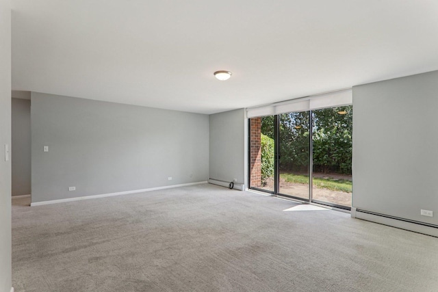 4711 Saint Joseph Creek Rd Unit 1E, Lisle, IL 60532 - carpeted spare room with a wall of windows and baseboards