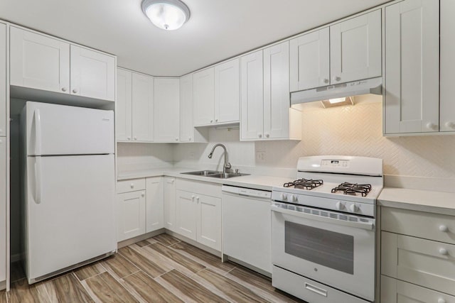 4711 Saint Joseph Creek Rd Unit 1E, Lisle, IL 60532 - kitchen with white appliances, under cabinet range hood, light countertops, white cabinetry, and light wood-style flooring