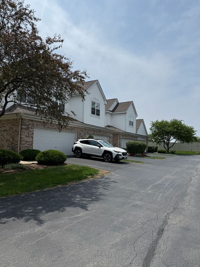 352 Bay Dr, Itasca, IL 60143 - view of side of home featuring a garage and driveway