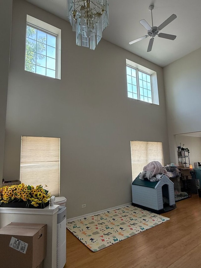 352 Bay Dr, Itasca, IL 60143 - foyer entrance with a towering ceiling, plenty of natural light, wood finished floors, ceiling fan, and a chandelier