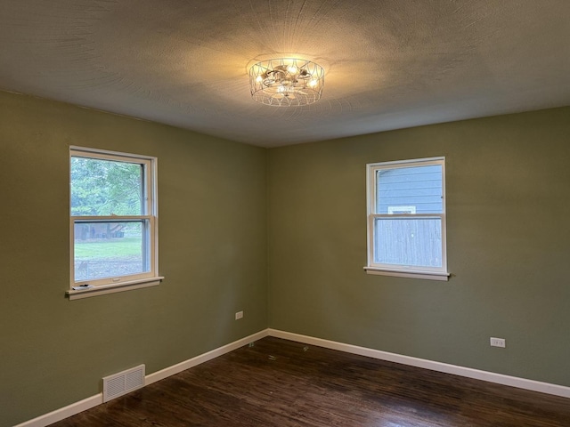 656 Springfield Ave, Joliet, IL 60435 - unfurnished room featuring dark wood-style flooring and baseboards