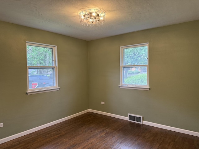 656 Springfield Ave, Joliet, IL 60435 - unfurnished room with plenty of natural light and dark wood finished floors