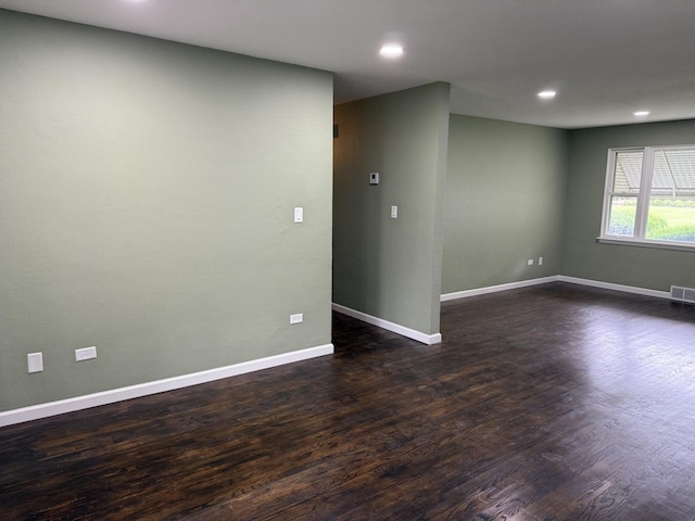 656 Springfield Ave, Joliet, IL 60435 - unfurnished room with dark wood-type flooring and recessed lighting