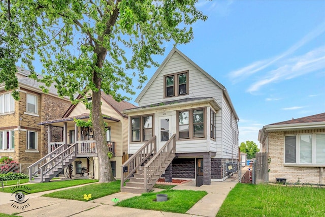 5716 W 64th Pl, Chicago, IL 60638 - view of front of home featuring a porch, stairs, and a gate