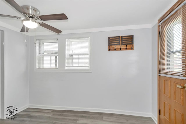 5716 W 64th Pl, Chicago, IL 60638 - spare room featuring wood finished floors and a ceiling fan