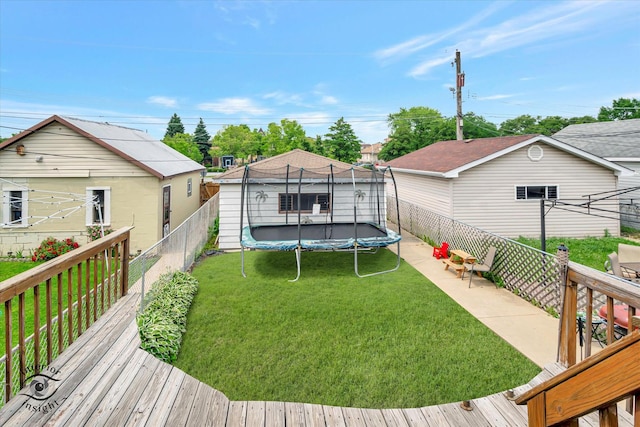 5716 W 64th Pl, Chicago, IL 60638 - fenced backyard featuring a trampoline and a deck