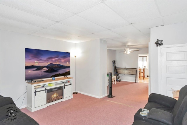 5716 W 64th Pl, Chicago, IL 60638 - carpeted living area with a paneled ceiling, a glass covered fireplace, and ceiling fan