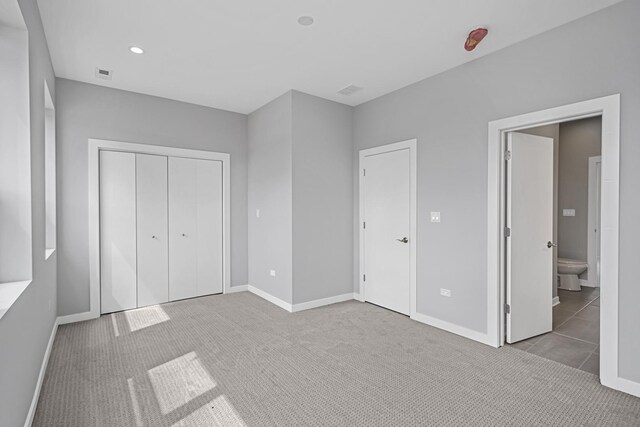 7239 S Exchange Ave, Chicago, IL 60649 - unfurnished bedroom featuring carpet flooring, a closet, and ensuite bath