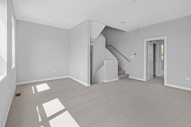 7239 S Exchange Ave, Chicago, IL 60649 - unfurnished living room with stairs and carpet flooring