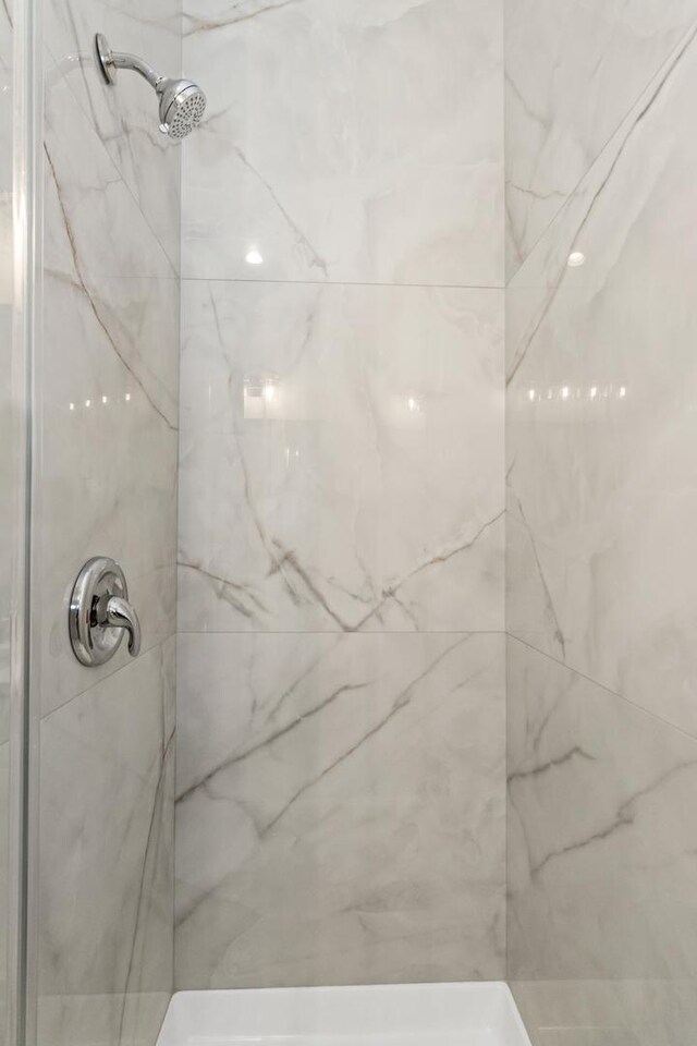 7239 S Exchange Ave, Chicago, IL 60649 - full bathroom featuring a marble finish shower