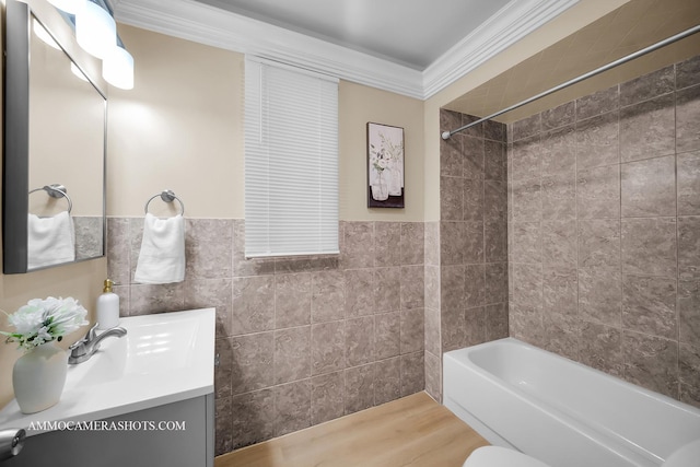5029 W Superior St, Chicago, IL 60644 - bathroom featuring tile walls, vanity, wood finished floors, shower / tub combination, and crown molding