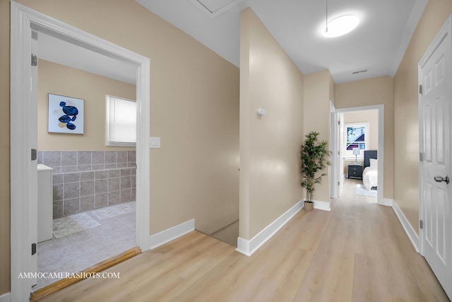 5029 W Superior St, Chicago, IL 60644 - hallway with healthy amount of natural light and wood finished floors