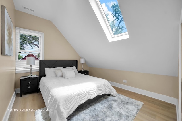 5029 W Superior St, Chicago, IL 60644 - bedroom featuring wood finished floors and lofted ceiling