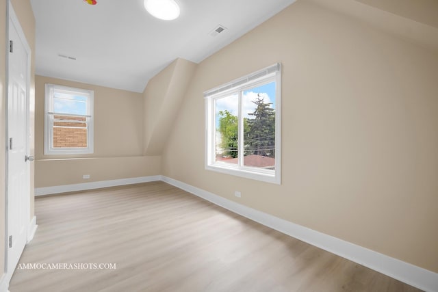 5029 W Superior St, Chicago, IL 60644 - bonus room with vaulted ceiling, light wood finished floors, and plenty of natural light
