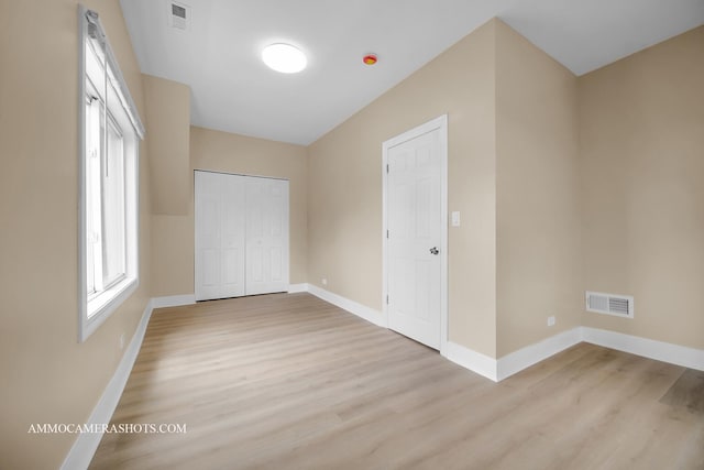 5029 W Superior St, Chicago, IL 60644 - unfurnished bedroom featuring light wood-style floors and a closet